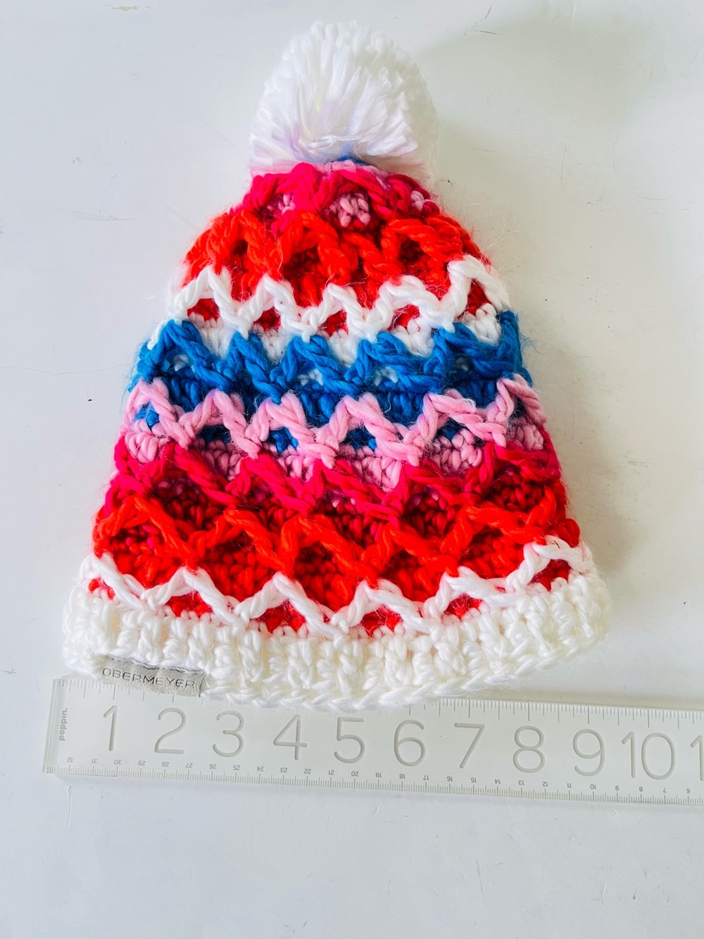 Obermeyer Teen  knit hat white blue red with pompom